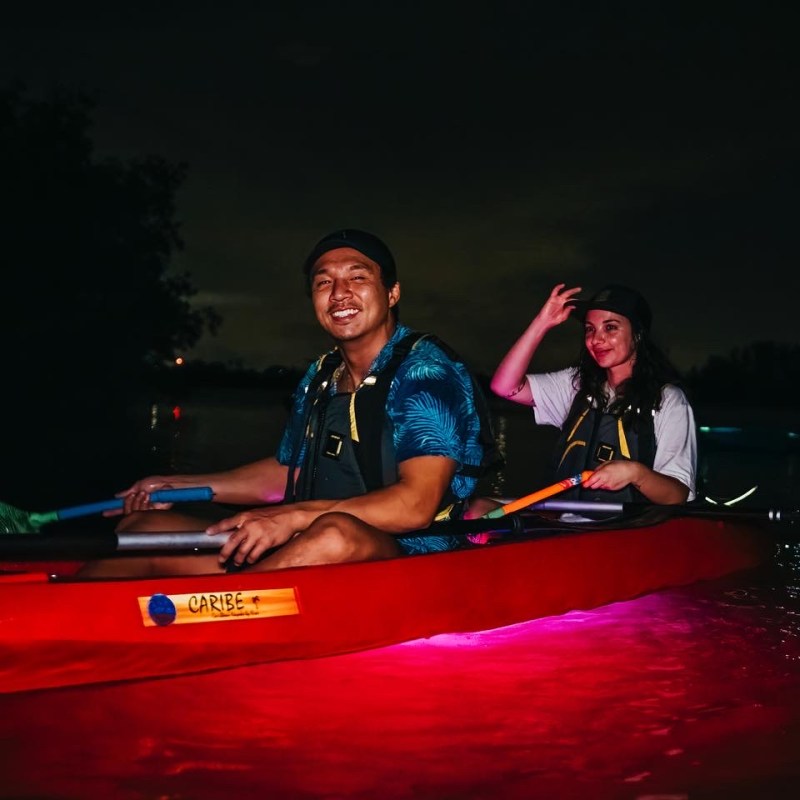 a man sitting on a boat in the water