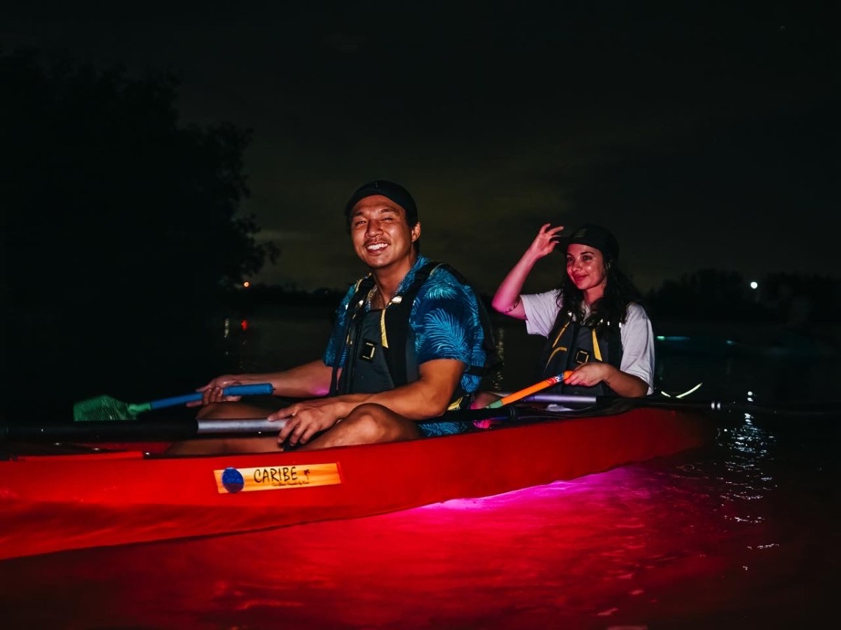 a man sitting on a boat in the water