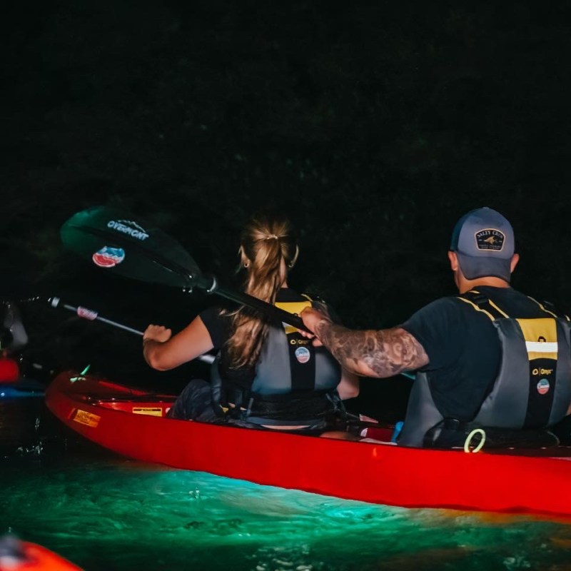 a person riding on the back of a boat