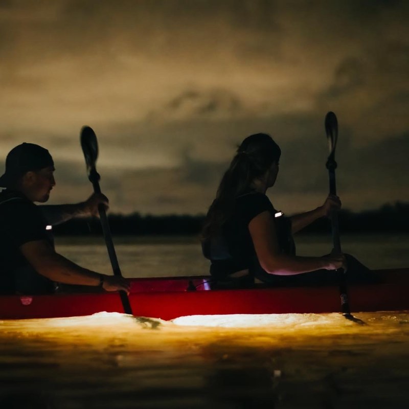 a man riding on the back of a boat