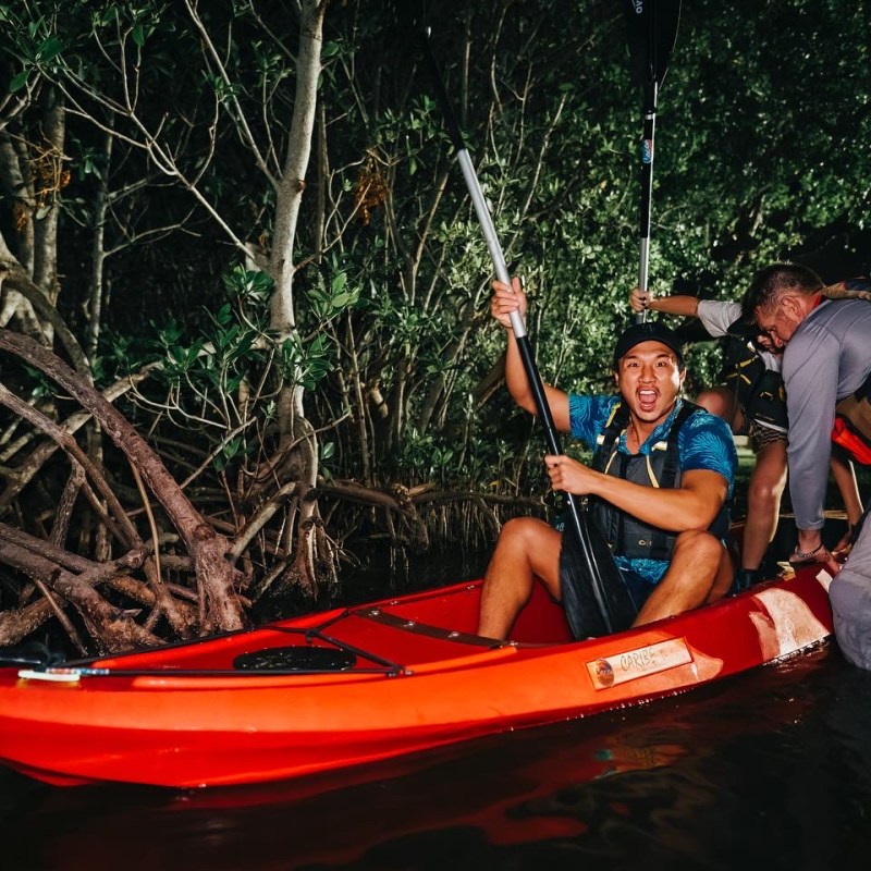 a man riding on the back of a boat