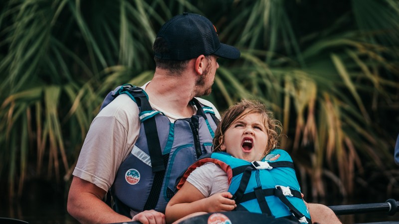 IMG_3042 a man riding a surfboard in the water
