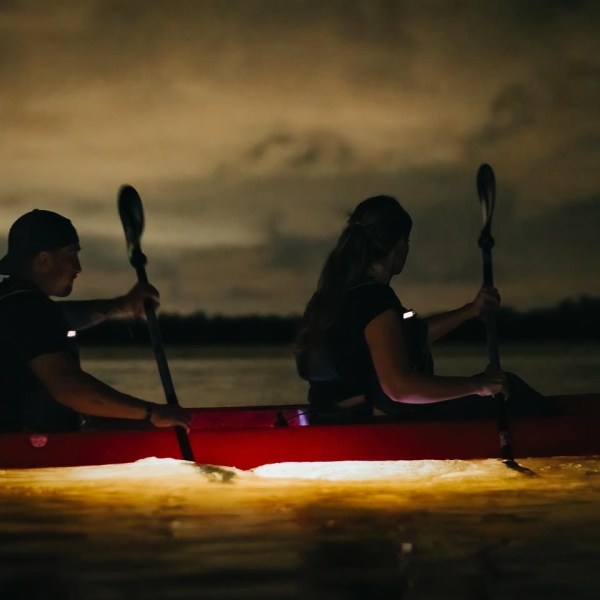 a man riding on the back of a boat