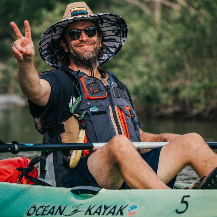 a man holding a baseball bat