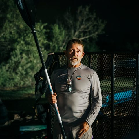 a man holding a baseball bat