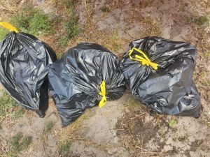 a person lying on top of a grass covered field