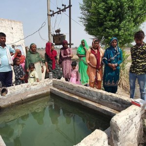 a group of people sitting at a zoo