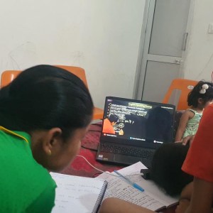 a young boy sitting on a table
