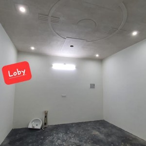 a room with a sink and a mirror