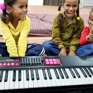 a group of people sitting at a piano