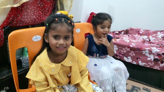 a small child sitting on a table