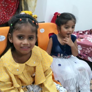 a small child sitting on a table