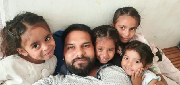 a group of people posing for the camera