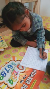 a little boy sitting on a table