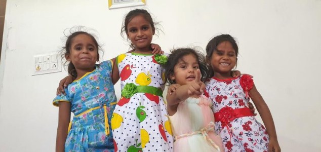 a little girl posing for a picture