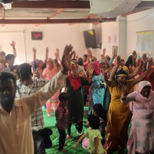 a group of people standing in front of a crowd
