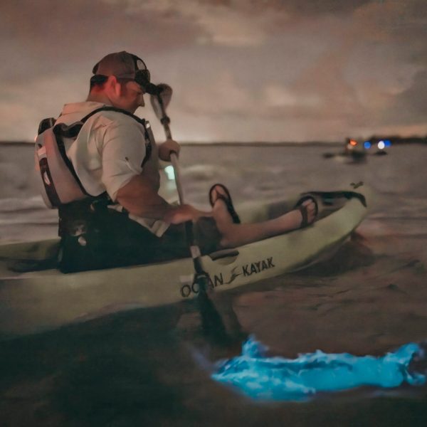 a man holding a surfboard