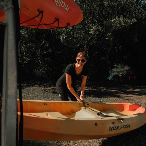 a person riding on the back of a boat