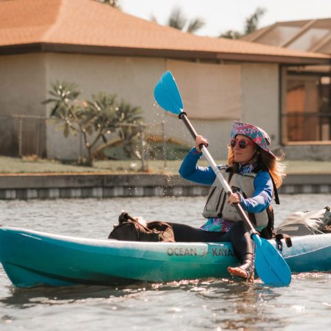a person riding on the back of a boat