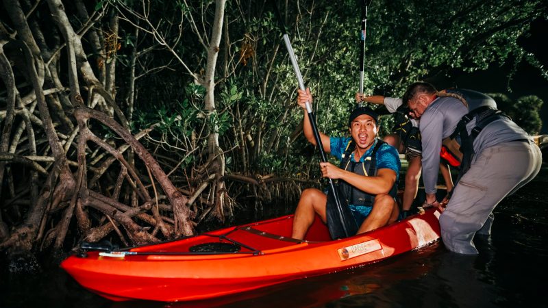 IMG_2650 a man riding on the back of a boat