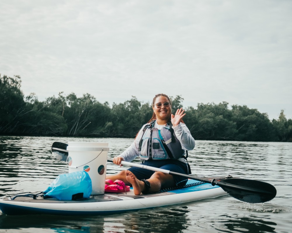 a person rowing a boat in the water