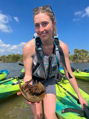 a person standing in front of water