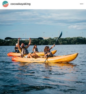 a group of people on a boat in the water