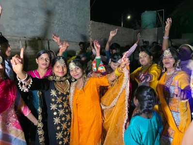 a group of people standing in front of a crowd posing for the camera