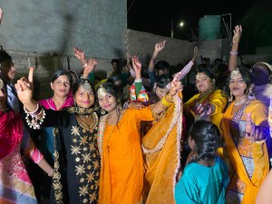 a group of people standing in front of a crowd posing for the camera