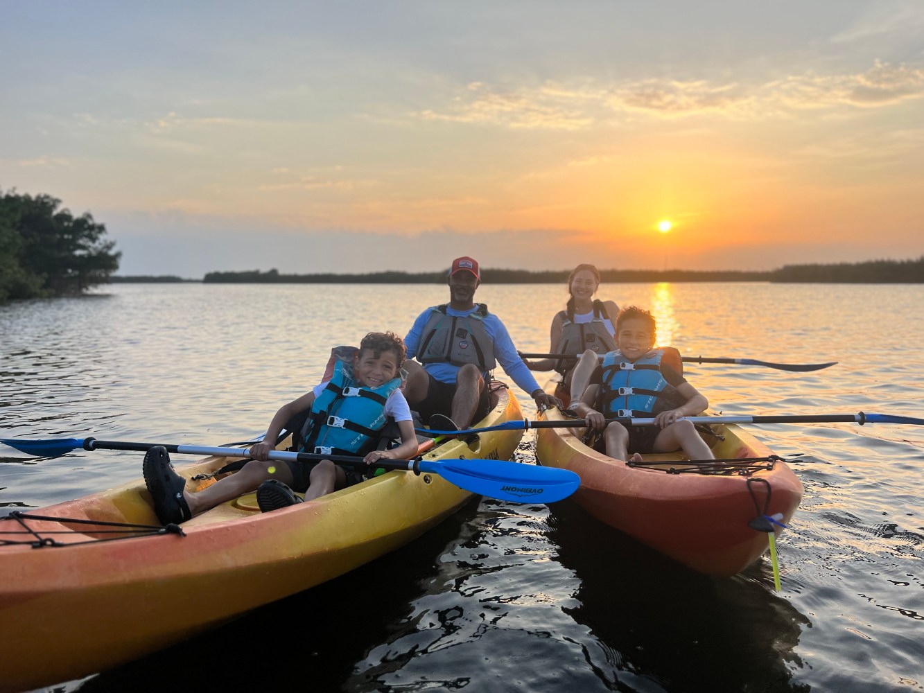 a couple of people that are sitting on a boat in the water