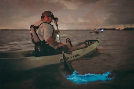 a man holding a surfboard