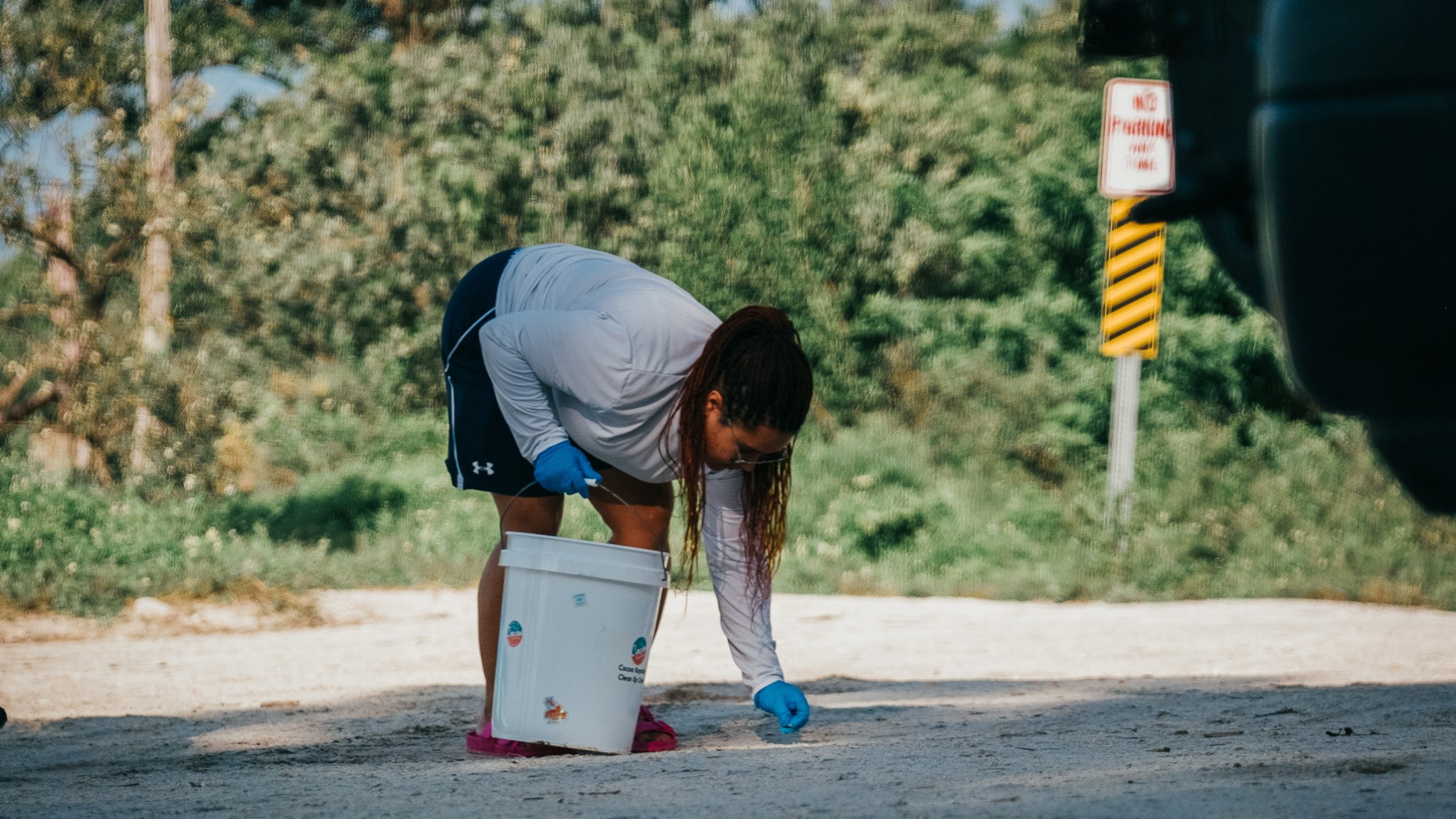 a man walking down a dirt road