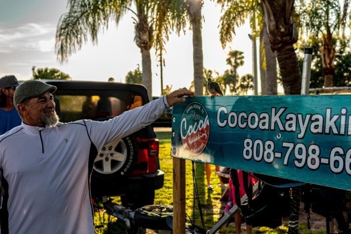a man holding a sign