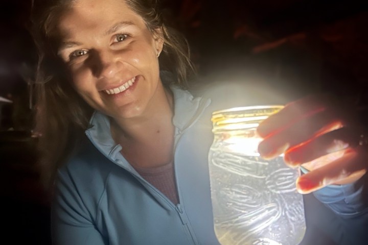 a woman holding a wine glass
