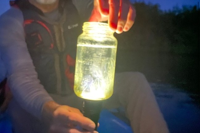 a man holding a glass of wine