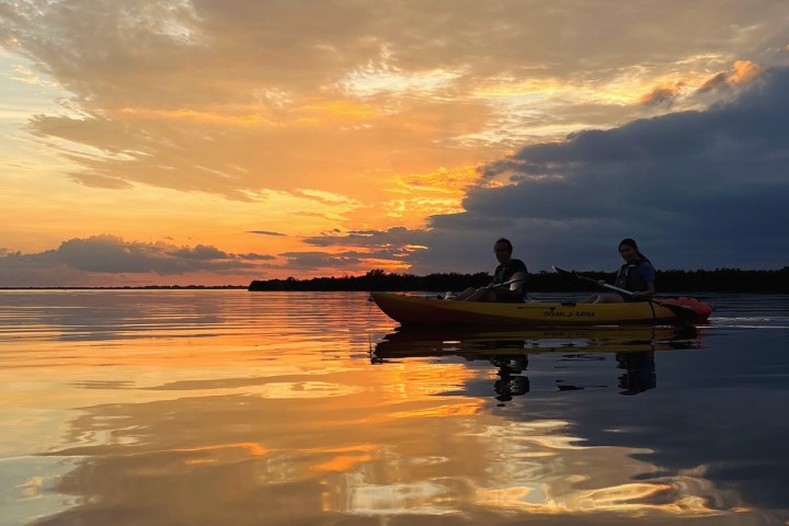 a sunset over a body of water