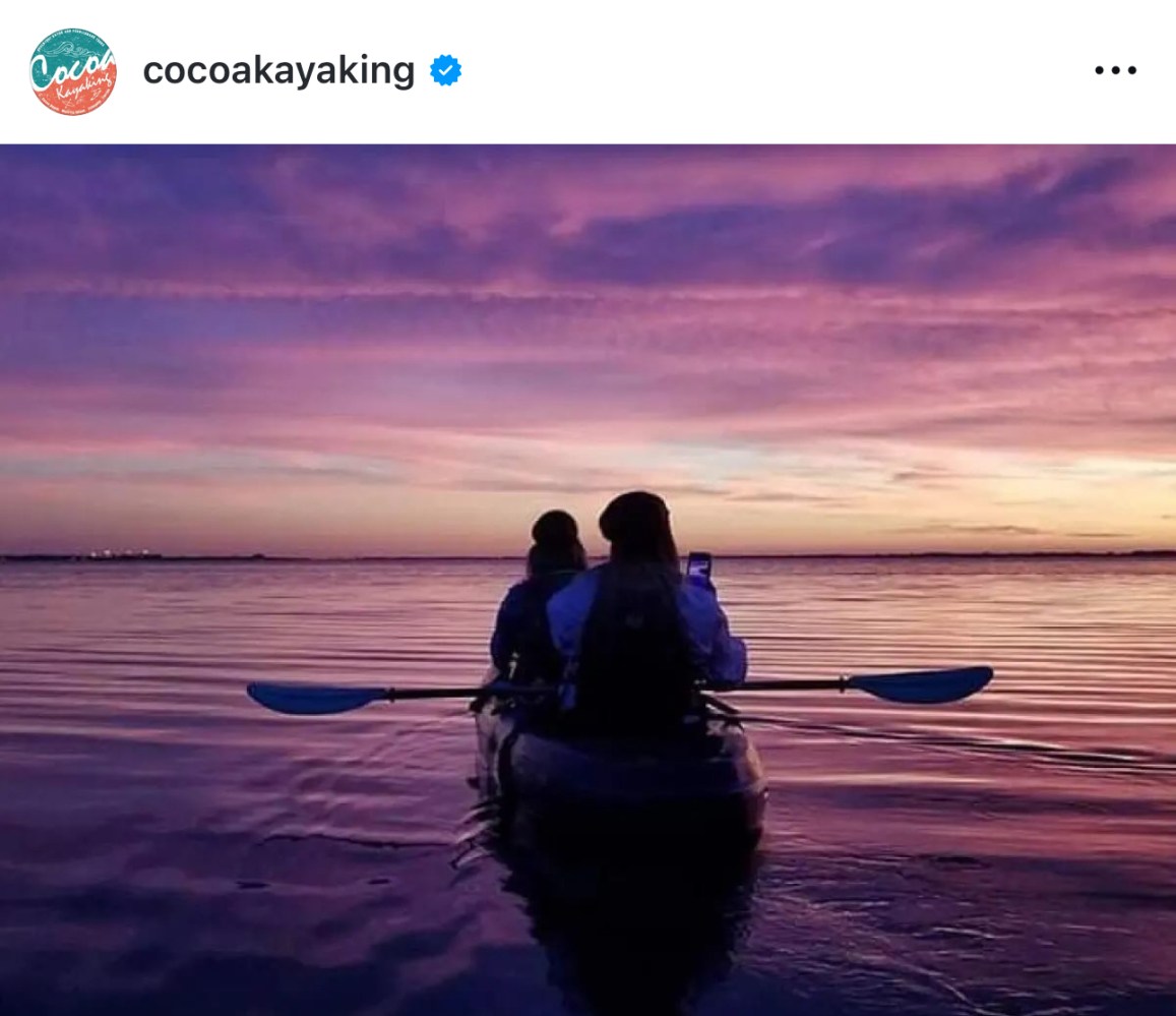 a couple of people that are standing in the water