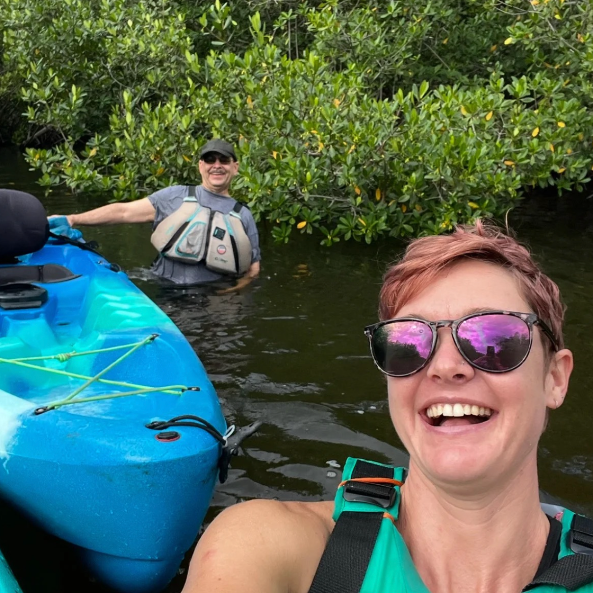 a group of people on a boat in the water